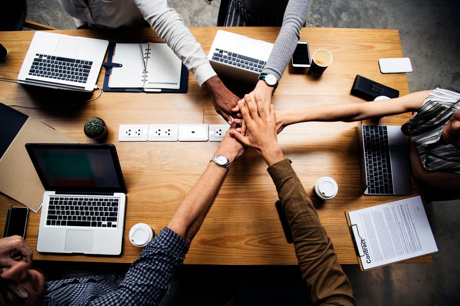 team-business-people-stacking-hands